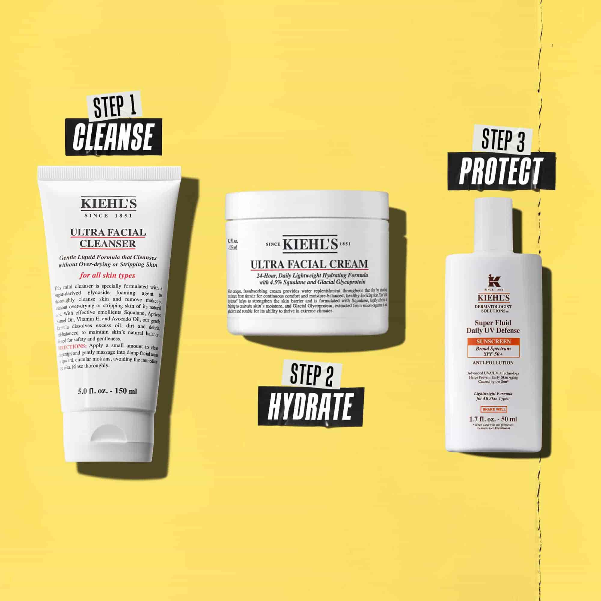 Tre prodotti Kiehl's che rappresentano una routine. Da sinistra a destra: detergente, idratante e protezione solare.
