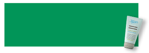 Un tubo di crema per la pelle su uno sfondo verde.